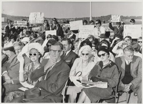 Conscription protesters and guests at the laying of the foundation stone of the National Library of Australia building, Canberra, 31 March 1966 / Canberra Times