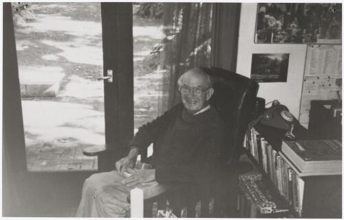 Geoffrey Sawer sitting inside a house in Guerilla Bay, New South Wales, approximately 1990