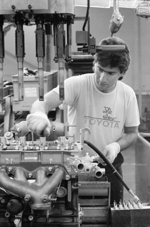An employee on the engine assembly line at Toyota motor vehicle manufacturing plant, Victoria, August, 1991 / Andrew Chapman