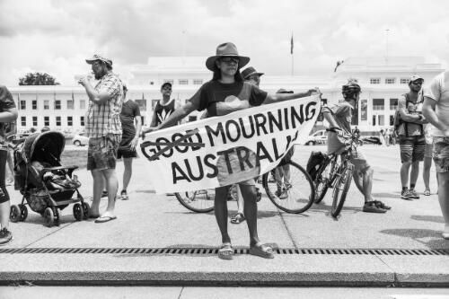Aboriginal Australians and protestors holding banners outside Old Parliament House, during the day of mourning march on Australia Day, Canberra, 26 January 2018 / Sean Davey