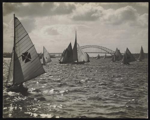 Sailing boats on the harbour and Sydney Harbour bridge at a distance, Sydney, approximately 1935