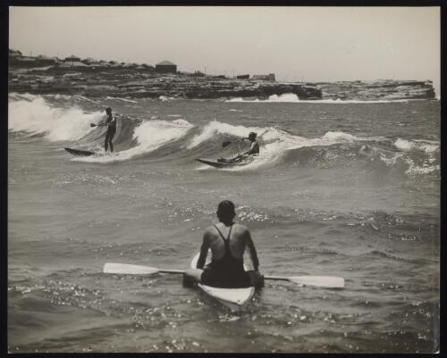 Surfers paddling in the waves, Sydney, approximately 1935