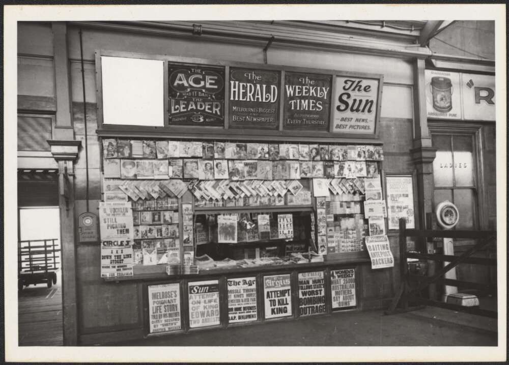 Newspaper stand in a railway station headlining attempt to kill King, Victoria, 1936
