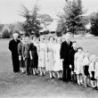 Members of a family standing in a line from oldest to youngest