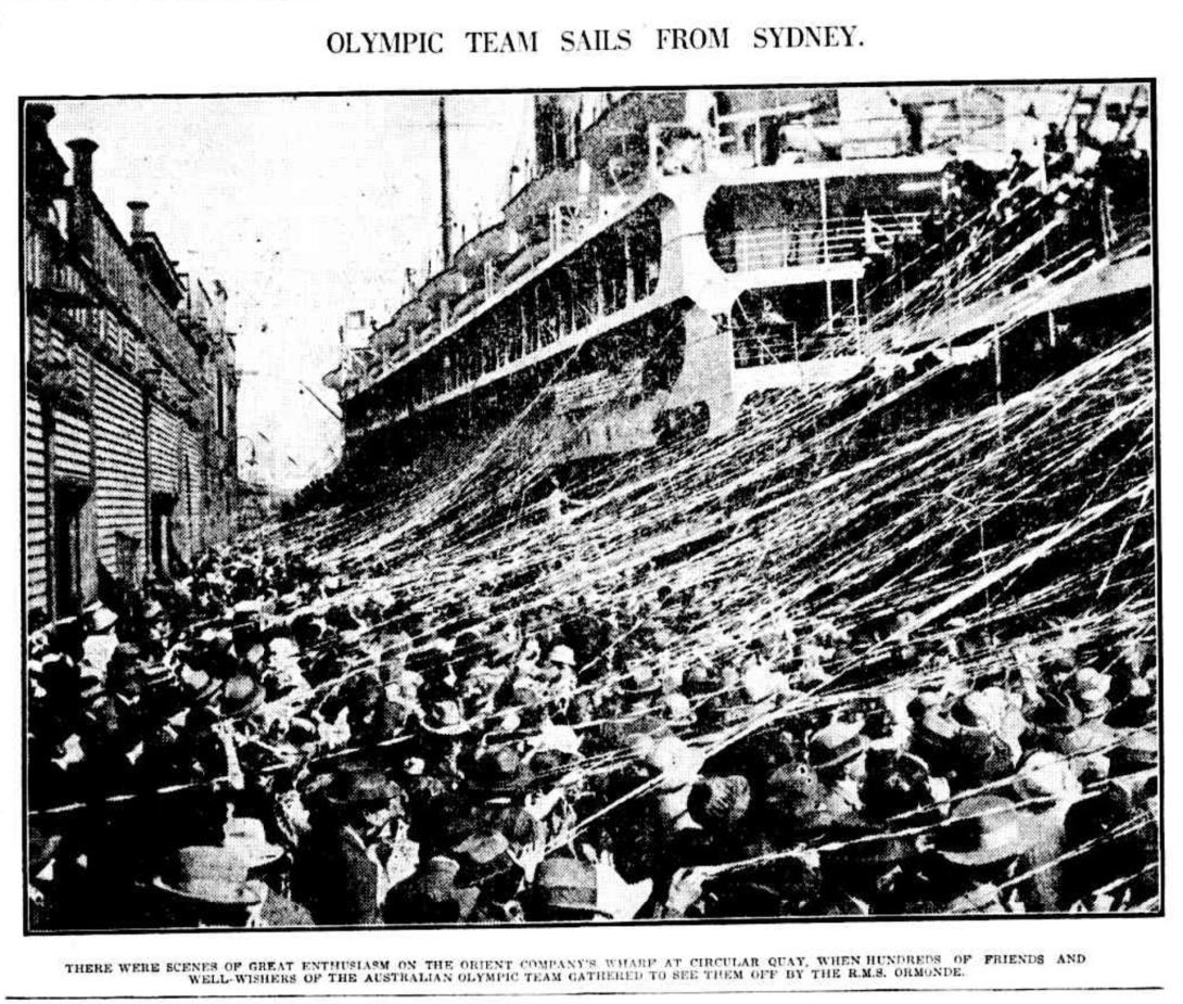 Black and white photo of streamers hanging between a boat about to depart and a large crowd seeing it off